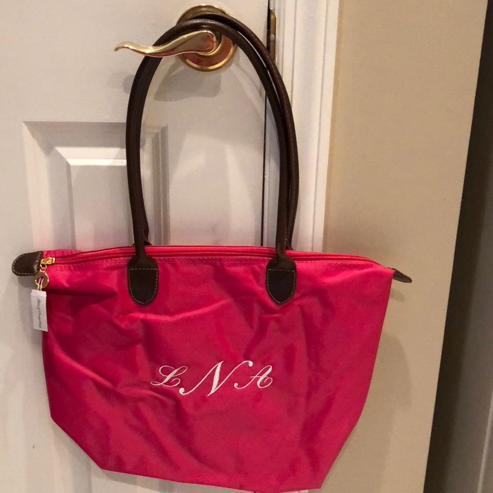 Fuschia monogrammed LNA nylon purse never used